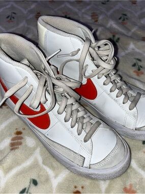 Nike White High-Top Sneakers with Red Swoosh
